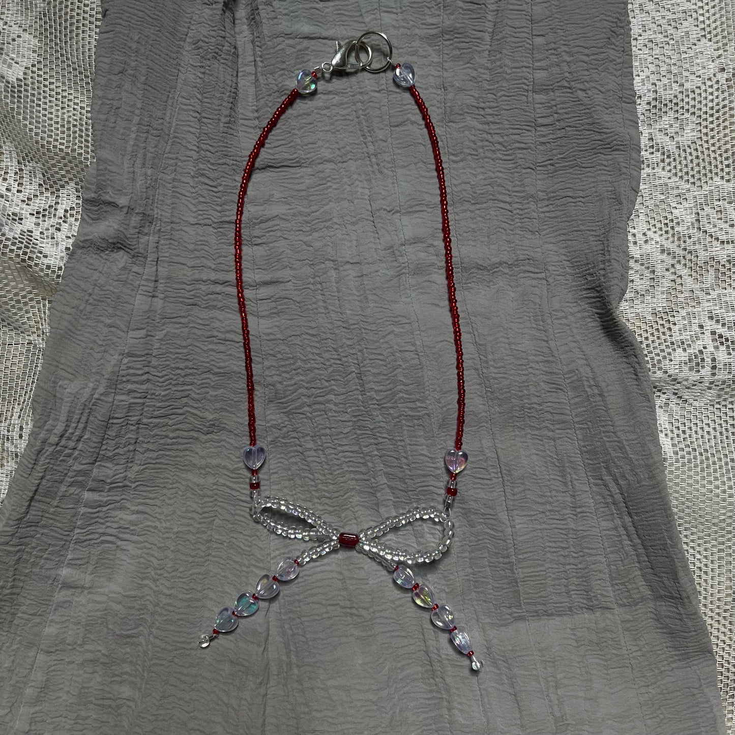 Scarlet bow necklaceꕤ