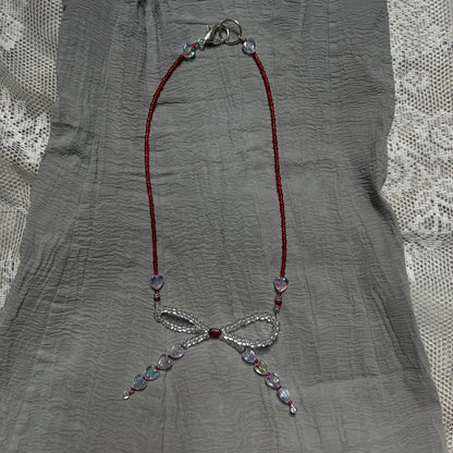 Scarlet bow necklaceꕤ